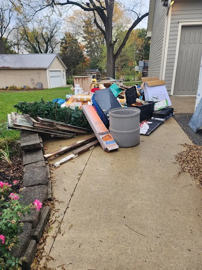 Dumpster being loaded with debris for Demolition Dumpster Rental in Briar Creek